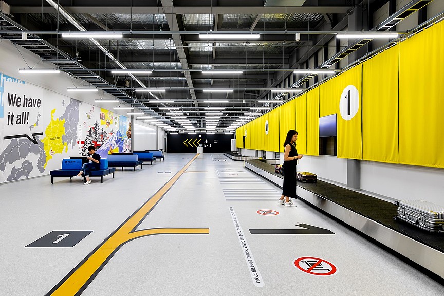 A person standing in a train station.